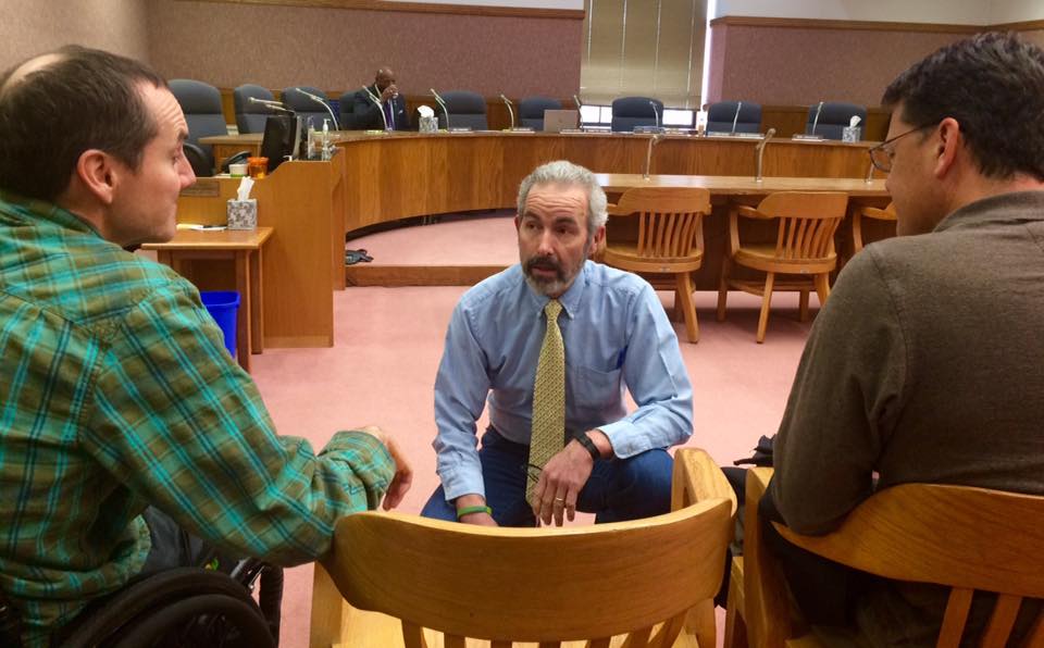 Max Woodbury with fellow Restore Justice for Survivors Coalition members at a press conference in Salem.