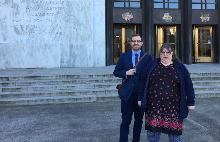 Attorney Scott Sell and Tina Martin standing outside the Oregon State Capitol, preparing to testify in defense of legal protections for Oregonians living with disabilities.