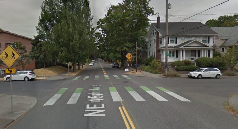 The NE Tillamook greenway crossing NE 15th Avenue, featuring green "crossbike" markings on the asphalt to let drivers know bikers will be crossing the road.