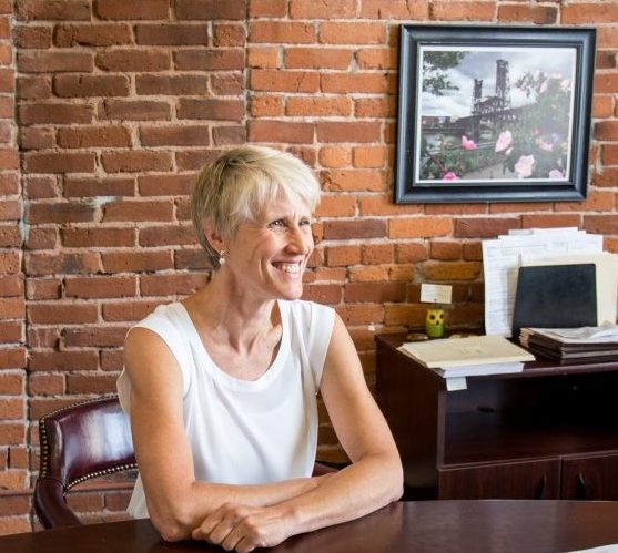 Cynthia Newton, a Portland personal injury attorney who specializes in medical malpractice cases, sitting at her desk at Thomas, Coon, Newton & Frost answering commonly asked questions about medical malpractice cases and what people should do if they believe medical malpractice happened to them.