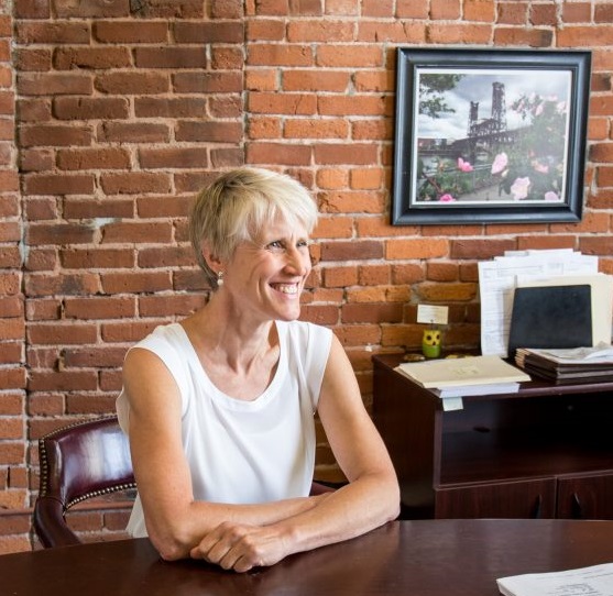 Cynthia Newton, a Portland personal injury attorney who specializes in medical malpractice cases, sitting at her desk at Thomas, Coon, Newton & Frost answering commonly asked questions about medical malpractice cases and what people should do if they believe medical malpractice happened to them.